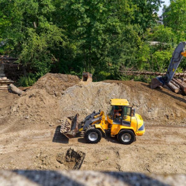 Heavy machinery at renaturation construction site of Glatt River at City of Zürich district Schwamendingen on a sunny hot summer day. Photo taken July 10th, 2023, Zurich, Switzerland.