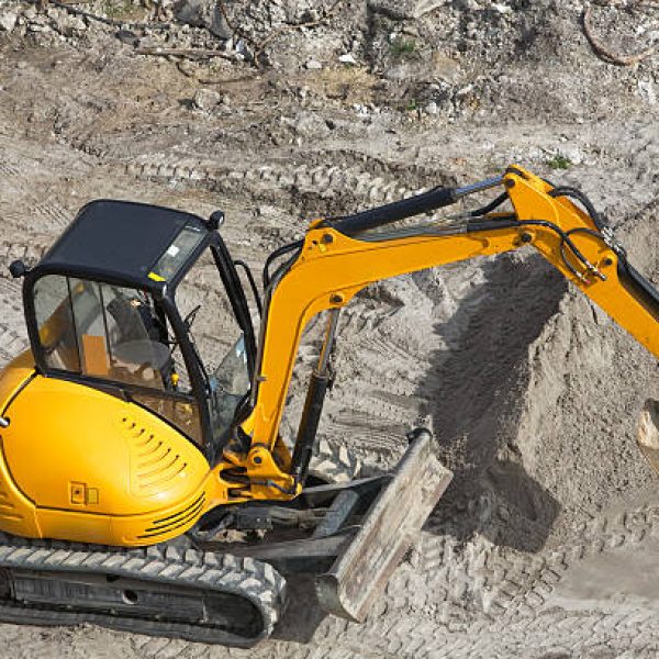 High angle view of yellow mini excavator